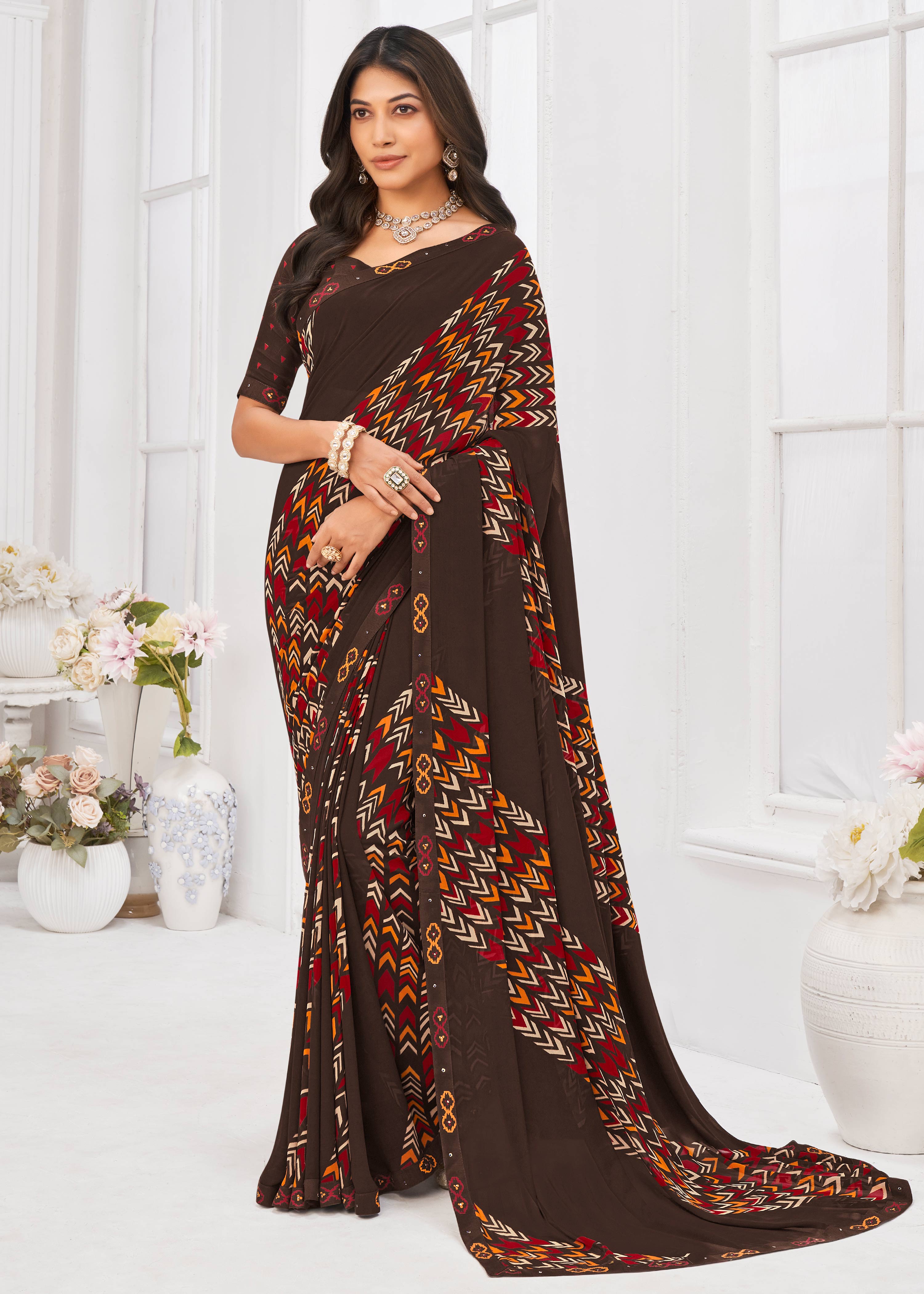 Laxmipati Dil Khushal Geometric Printed Georgette Saree in Brown Color with Unstitched Blouse