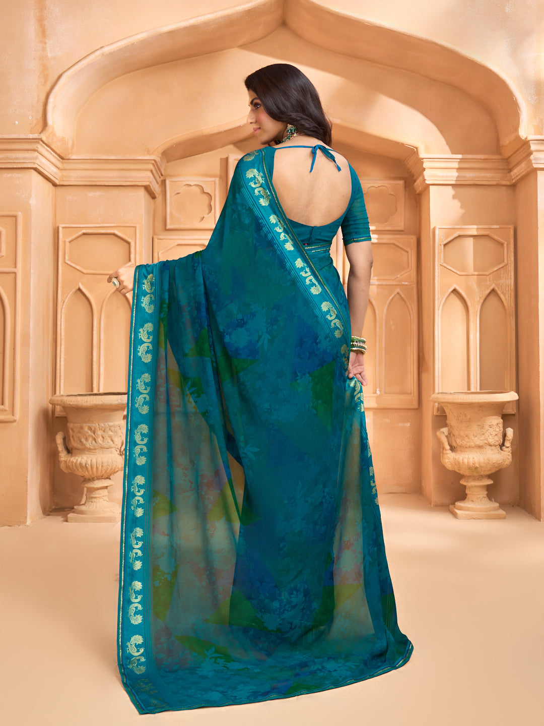 Laxmipati Tohfa Abstract Printed Georgette Saree in Teal Blue Color