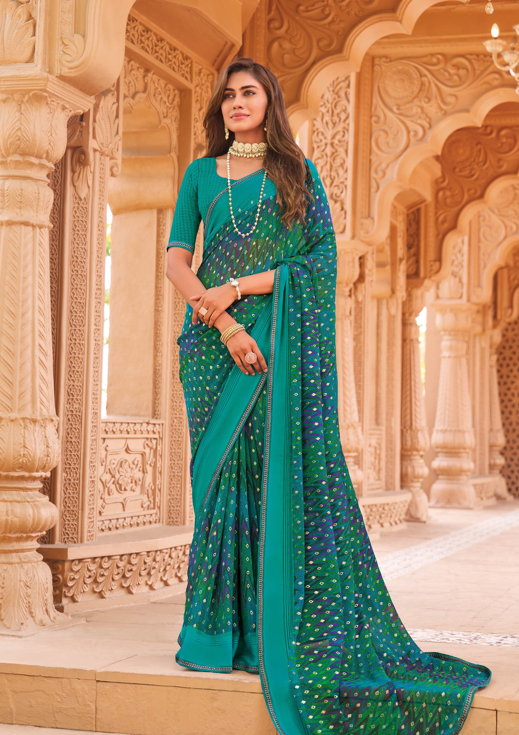 Laxmipati Madhubala Chevron Printed Georgette Saree in Teal Blue Color with Unstitched Blouse