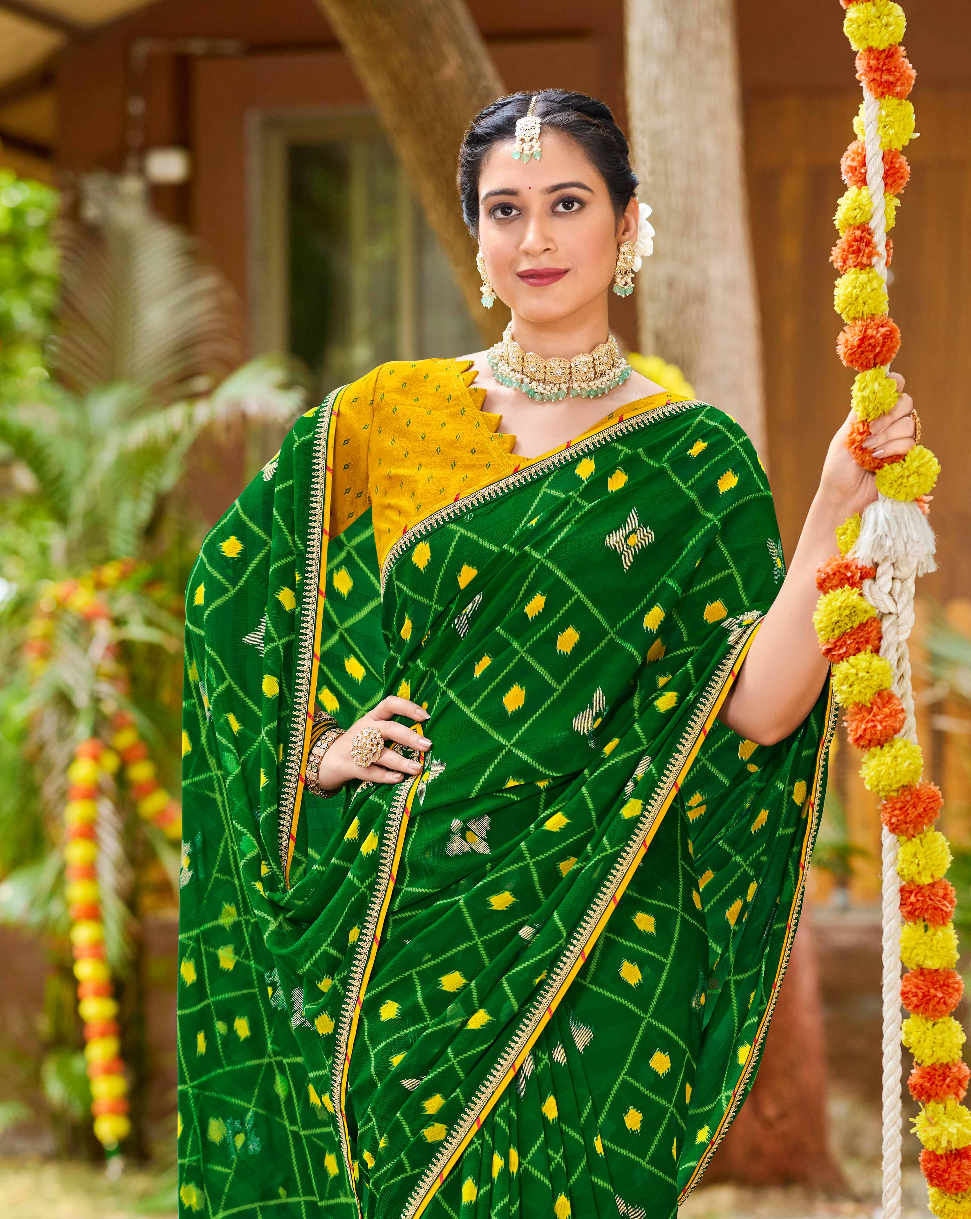 Laxmipati Upavan Ikkat Printed along with Foil Work Georgette Saree in Green Color with Unstitched Blouse