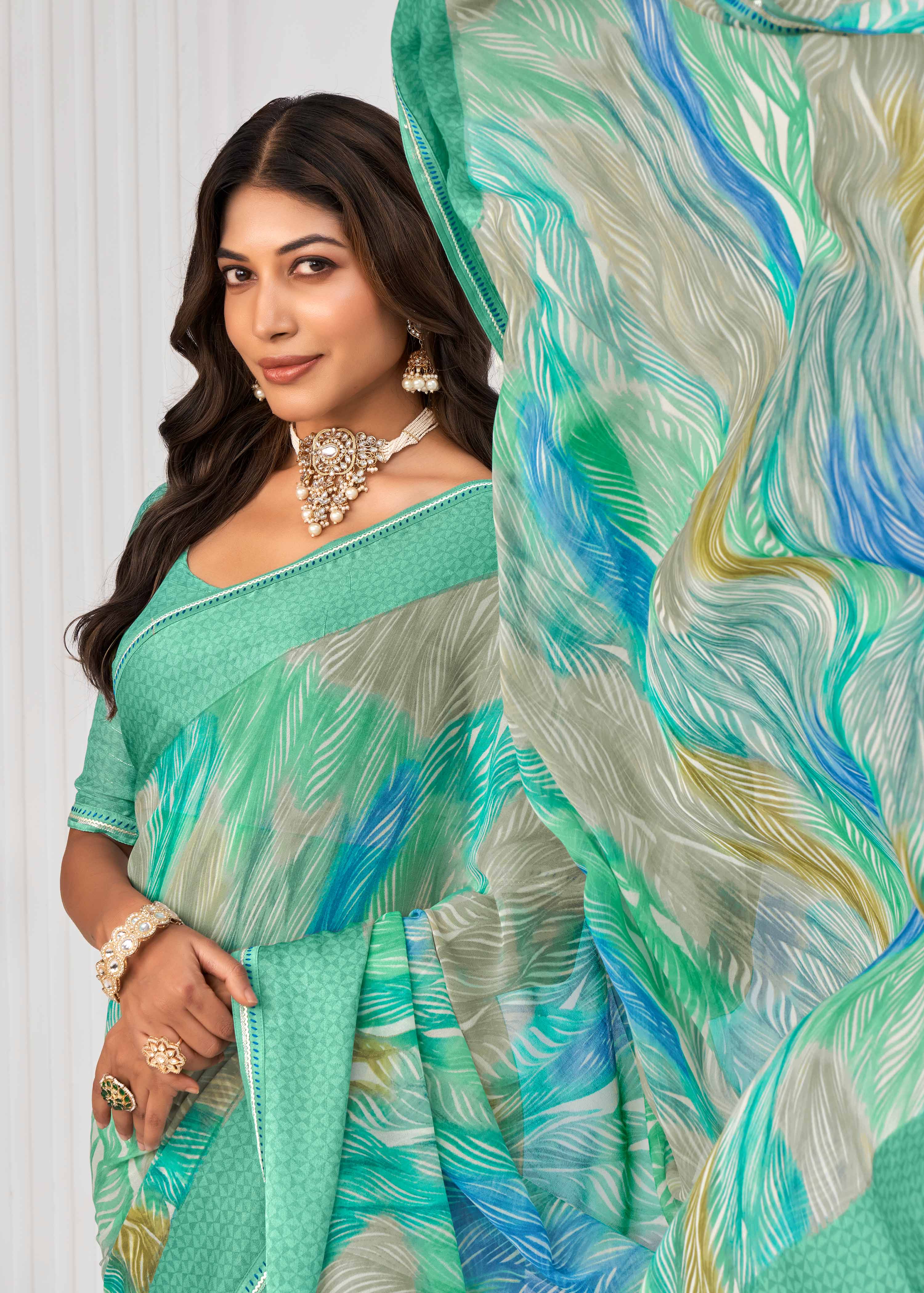 Laxmipati Sitaphal Geometric Printed Georgette Saree in Teal Green Color with Unstitched Blouse