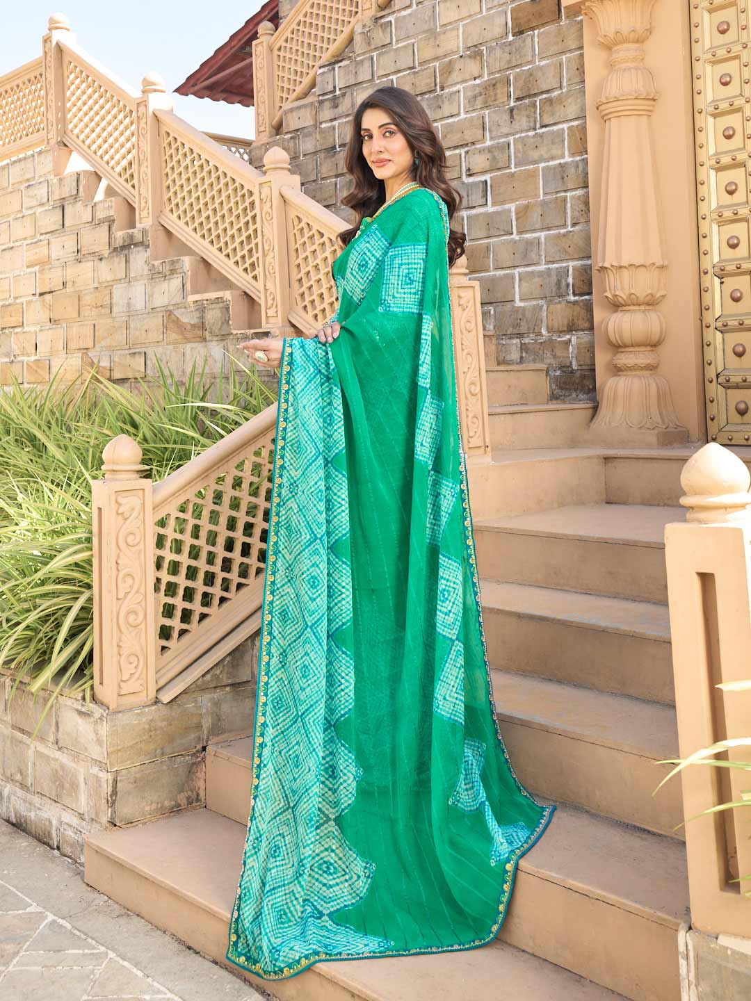 Teal green chiffon saree with blue blouse