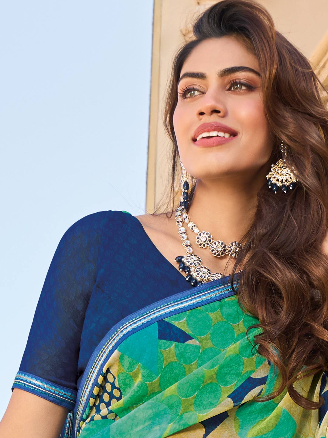 Printed teal georgette saree styling