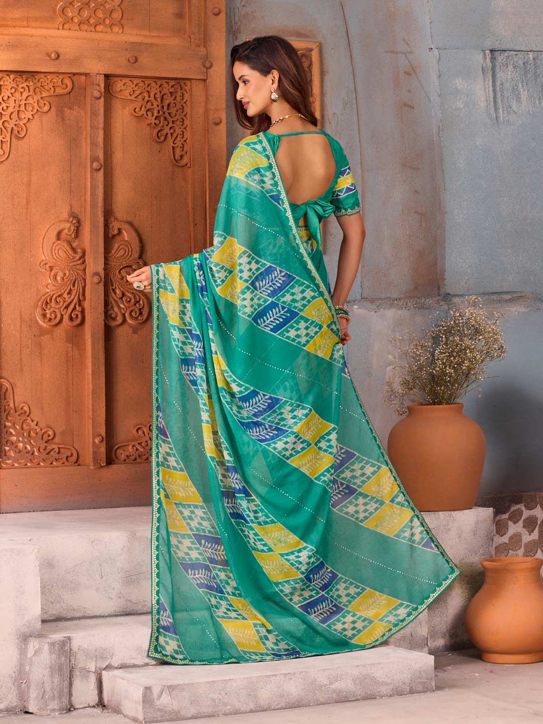 Blue geometric leaf printed chiffon saree festive wear