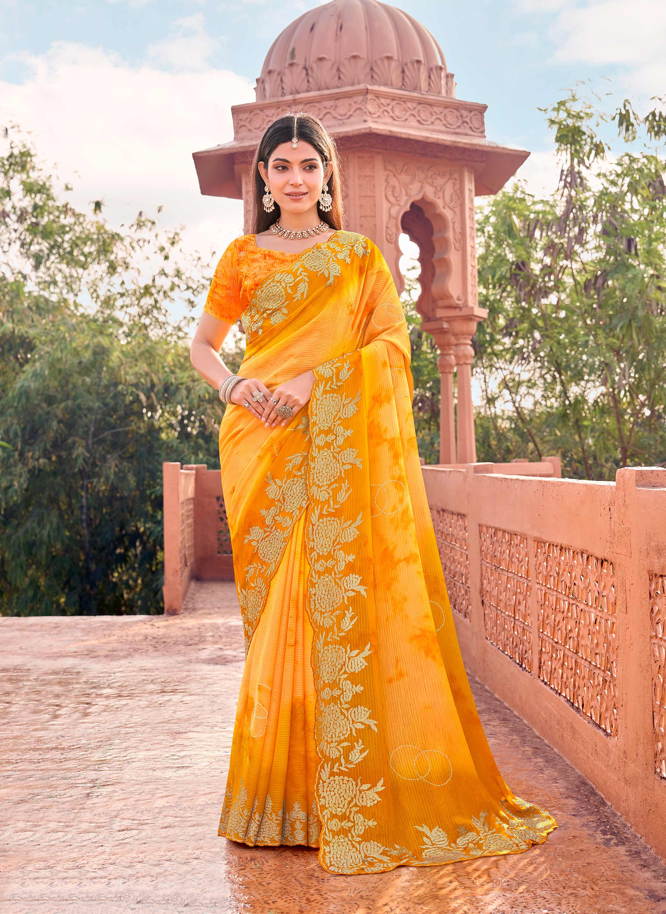 Yellow chiffon floral embroidered saree with heavy border