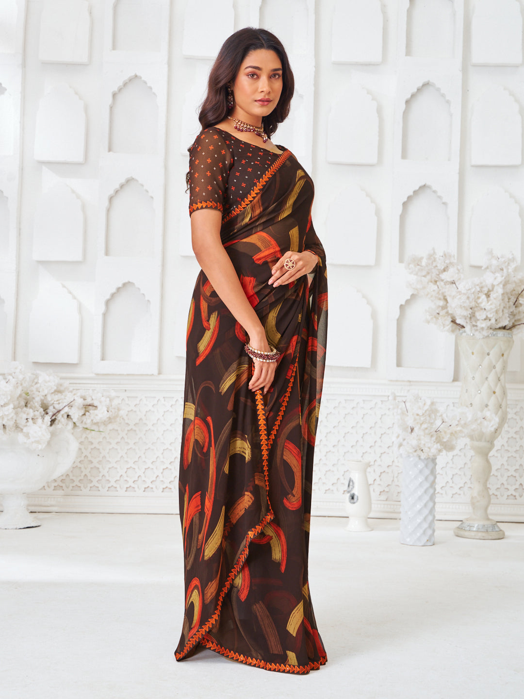 Laxmipati Kamya Brown Georgette Abstract Printed Saree