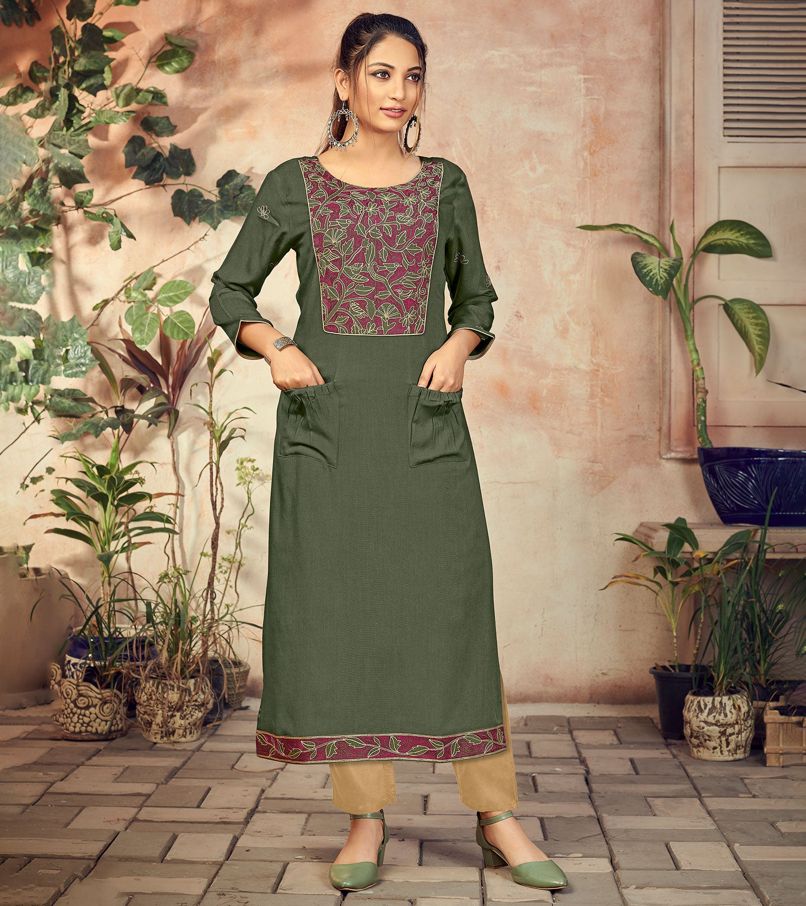 Laxmipati Rayon Jade Green Straight Cut Kurti Has Round Neck Variation , Embroidered Cufe & Different Yoke Pattern