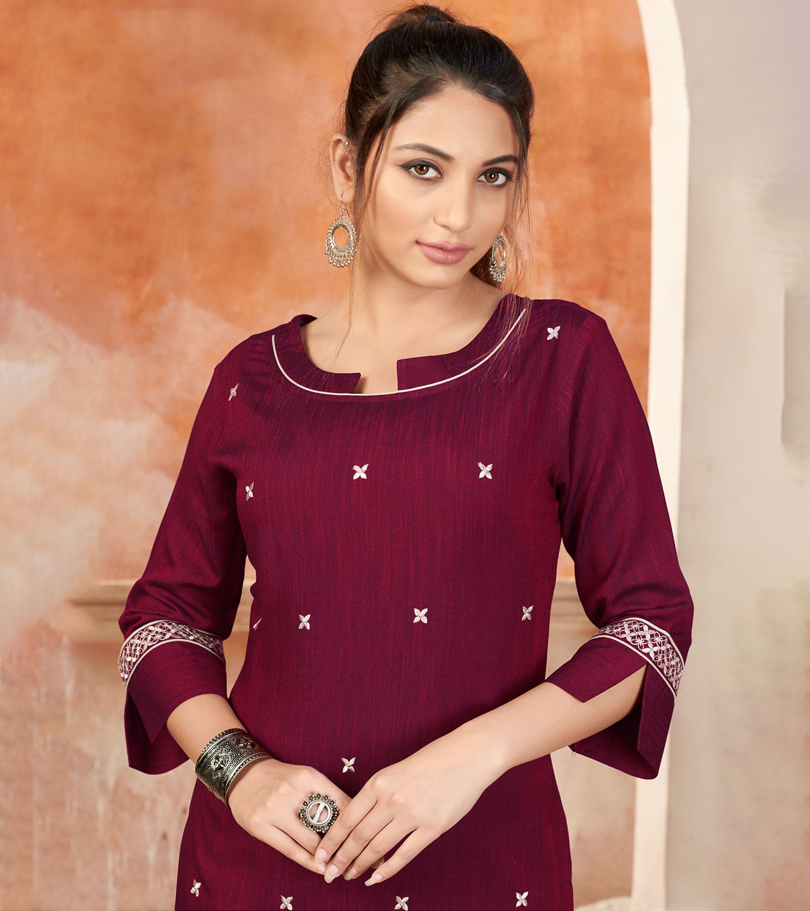 Laxmipati Bombay Velvet Mulberry Maroon Straight Kurti Have Fancy Necklines With All Over Grading Embossed Buttas & Laces Use Of Contrast Colour Effect, Along With Pant