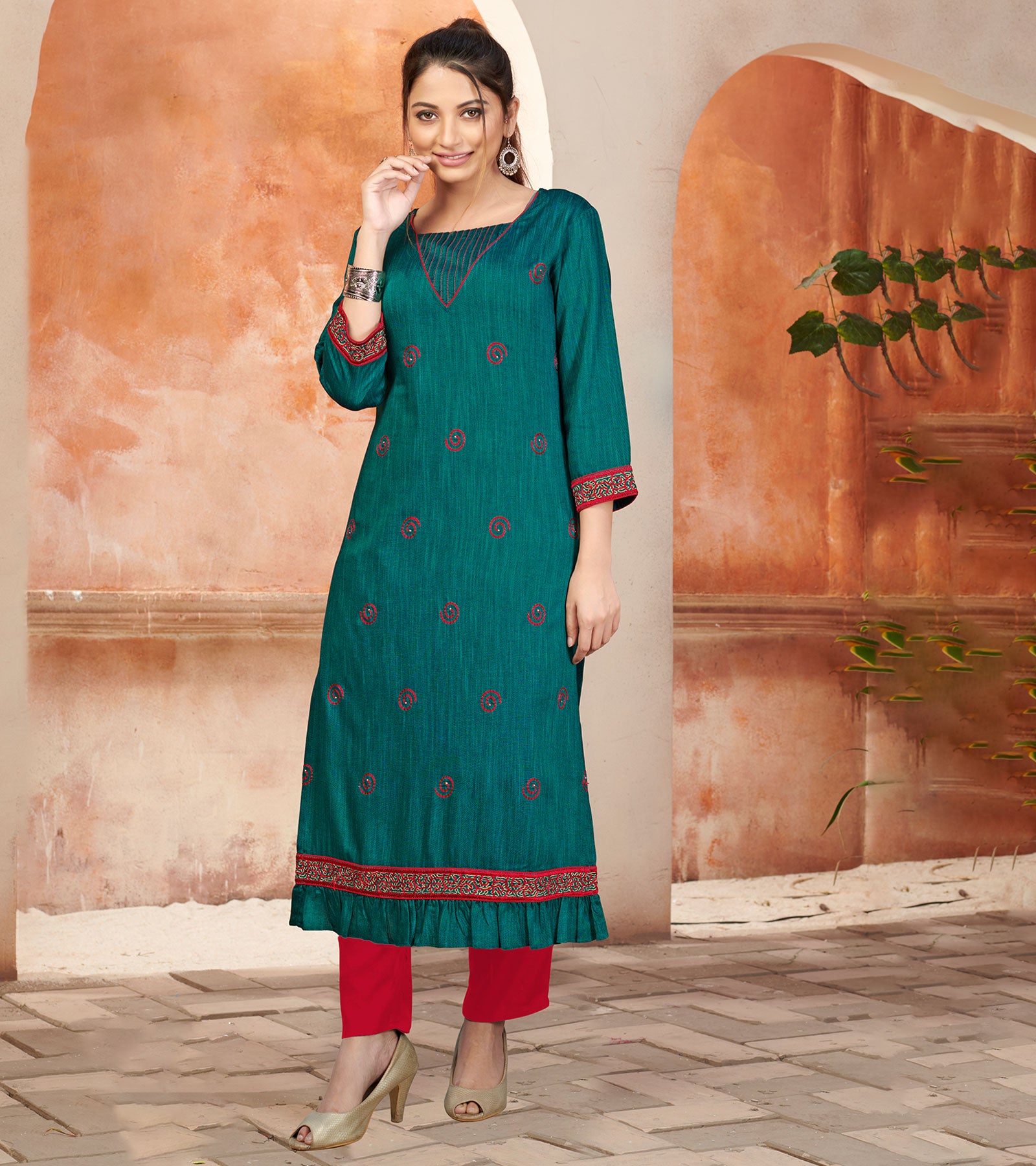 Laxmipati Bombay Velvet Peacock Green Straight Kurti Have Fancy Necklines With All Over Grading Embossed Buttas & Laces Use Of Contrast Colour Effect, Along With Pant
