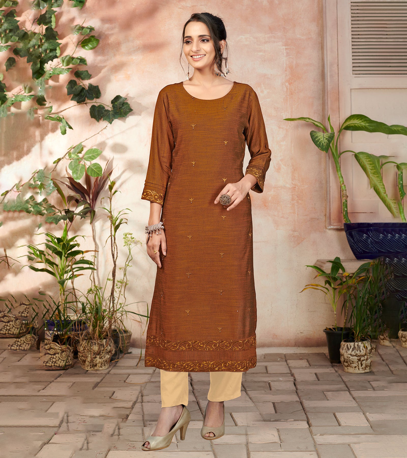 Laxmipati Bombay Velvet Cinamon Brown Straight Kurti Have Fancy Necklines With All Over Grading Embossed Buttas & Laces Use Of Contrast Colour Effect, Along With Pant