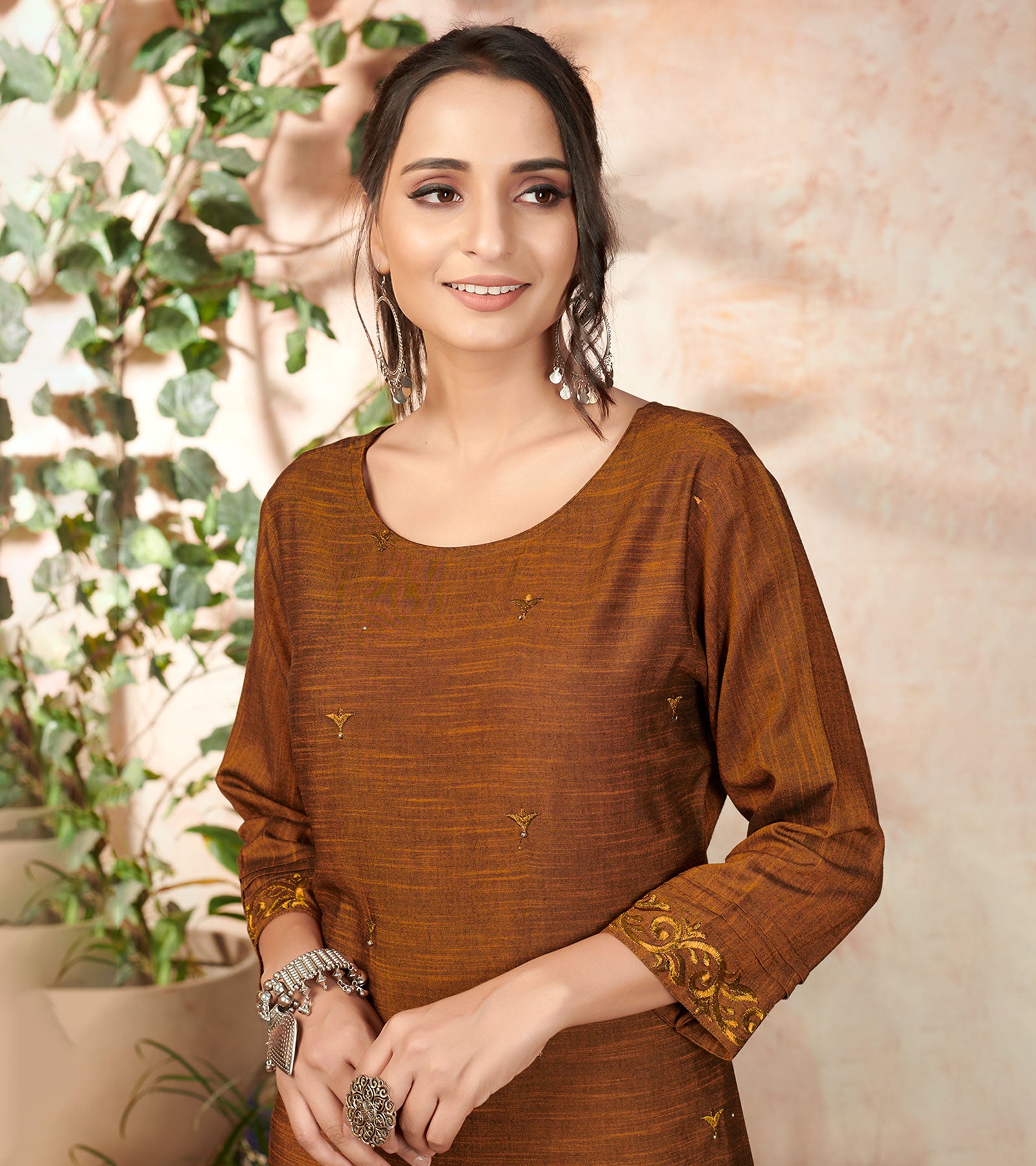 Laxmipati Bombay Velvet Cinamon Brown Straight Kurti Have Fancy Necklines With All Over Grading Embossed Buttas & Laces Use Of Contrast Colour Effect, Along With Pant