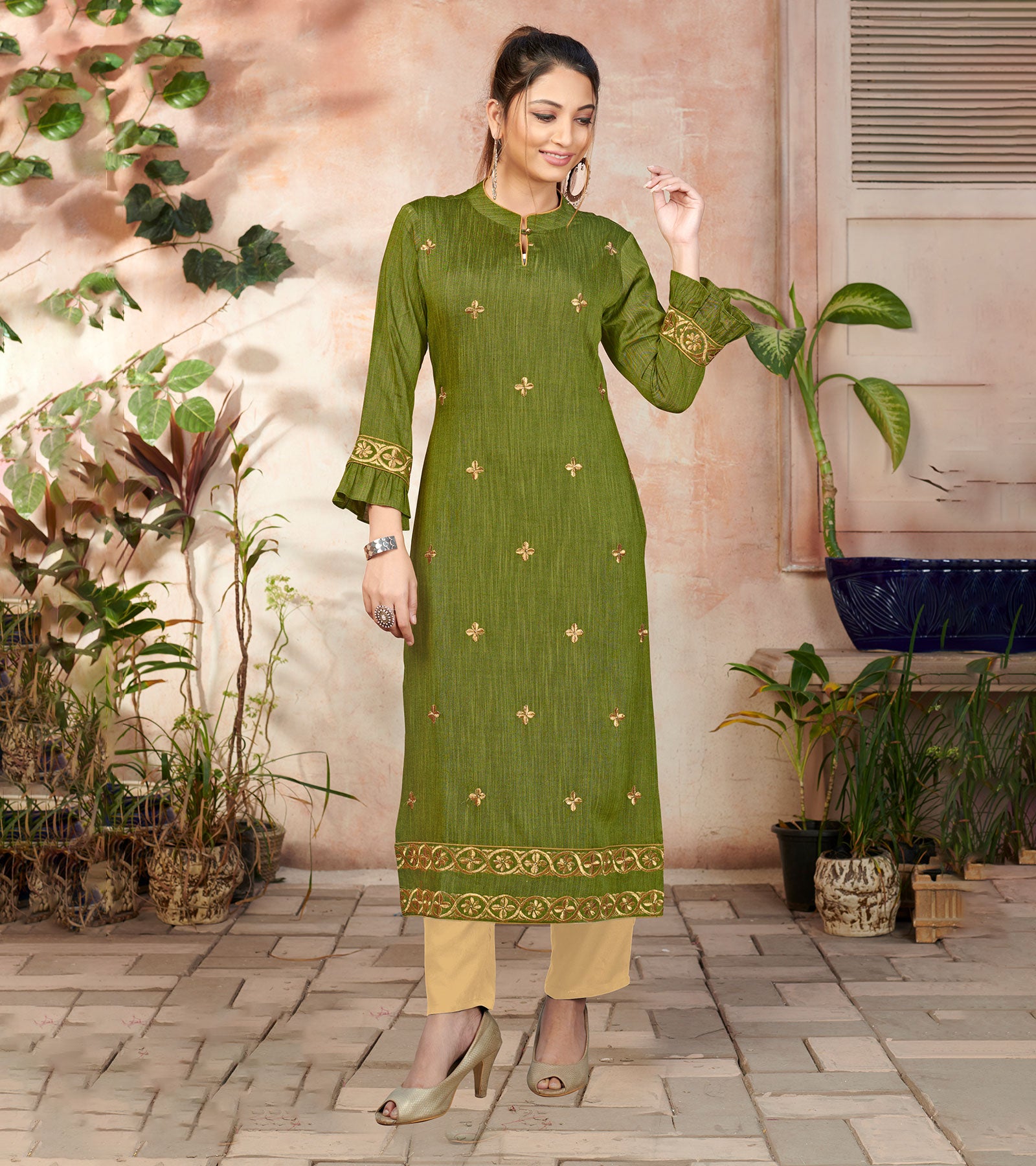 Laxmipati Bombay Velvet Leaf Green Straight Kurti Have Fancy Necklines With All Over Grading Embossed Buttas & Laces Use Of Contrast Colour Effect, Along With Pant