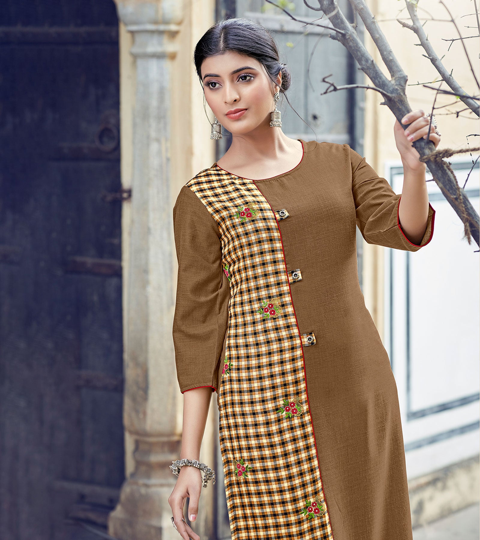 Laxmipati Rayon Cross And Swiss Slub Earthy Brown Ans Checks Kurti With Two Fabrics By Giving All Over Grading Butta With Different Princess Lines , Fancy Yoke , Classy Necklines And Sleeve With Comfy Cuff.