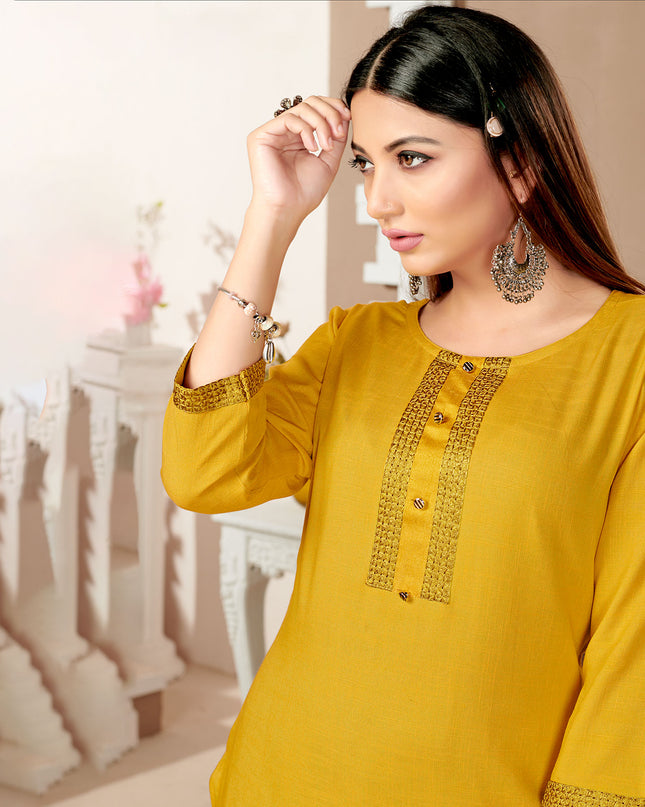 Laxmipati Rayon Cross Yellow  Beautifully Placed Embroidered Boarder Straightfit Kurti With Evergreen Necklines, Enhancing With Stylish Button .