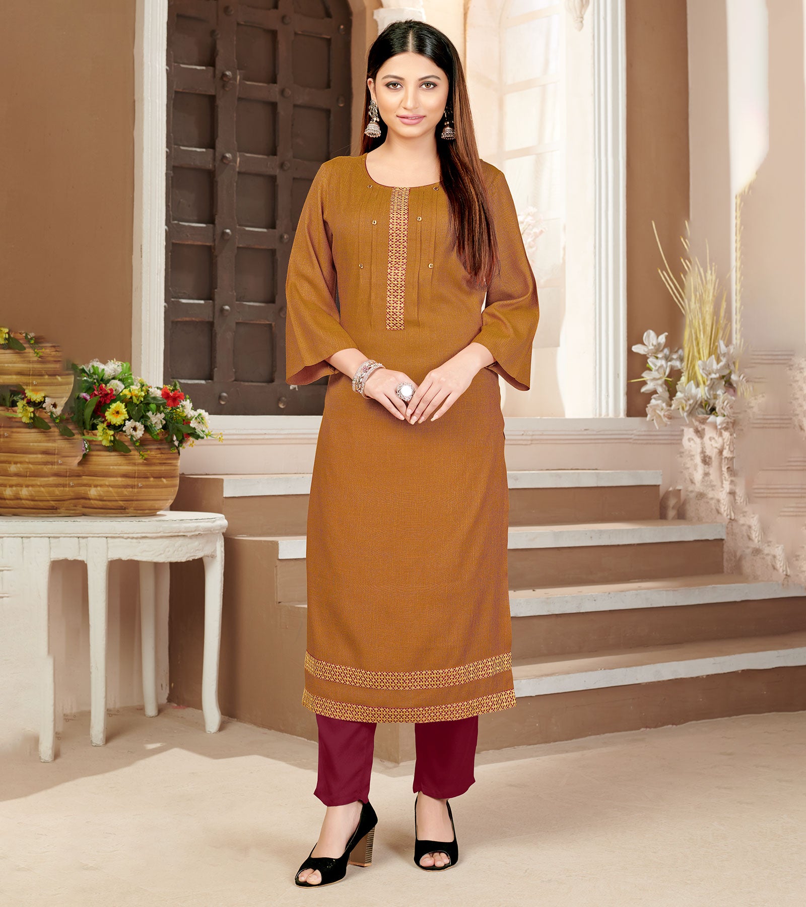 Laxmipati Rayon Cross Caramel Beautifully Placed Embroidered Boarder Straightfit Kurti With Evergreen Necklines, Enhancing With Stylish Button .
