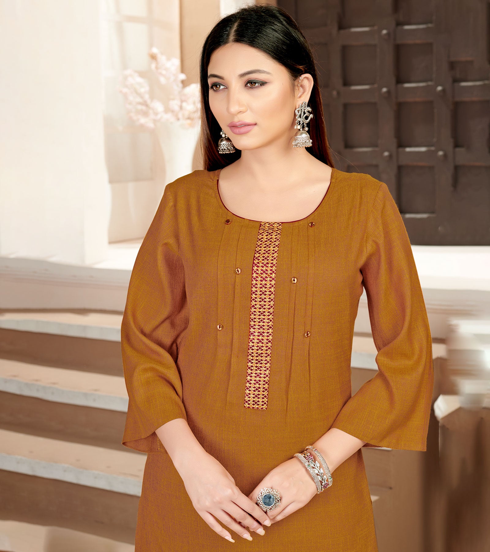 Laxmipati Rayon Cross Caramel Beautifully Placed Embroidered Boarder Straightfit Kurti With Evergreen Necklines, Enhancing With Stylish Button .