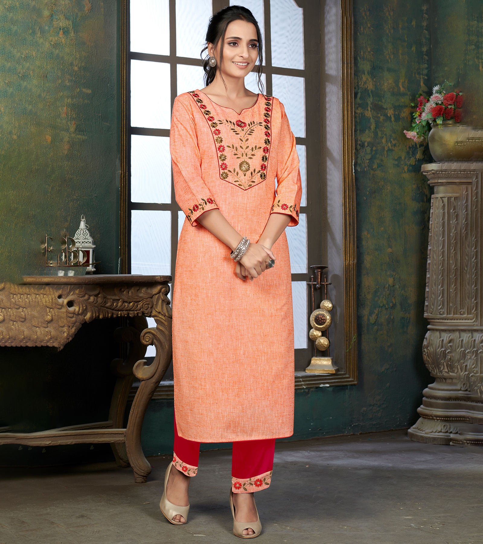Laxmipati Cotton Polo Flex Melon Orange Classy Straight Kurti With Simple Neck , While The Embroidery Detailed Bodice And Trims Add A Traditional Finishing Touch. Along With Pant