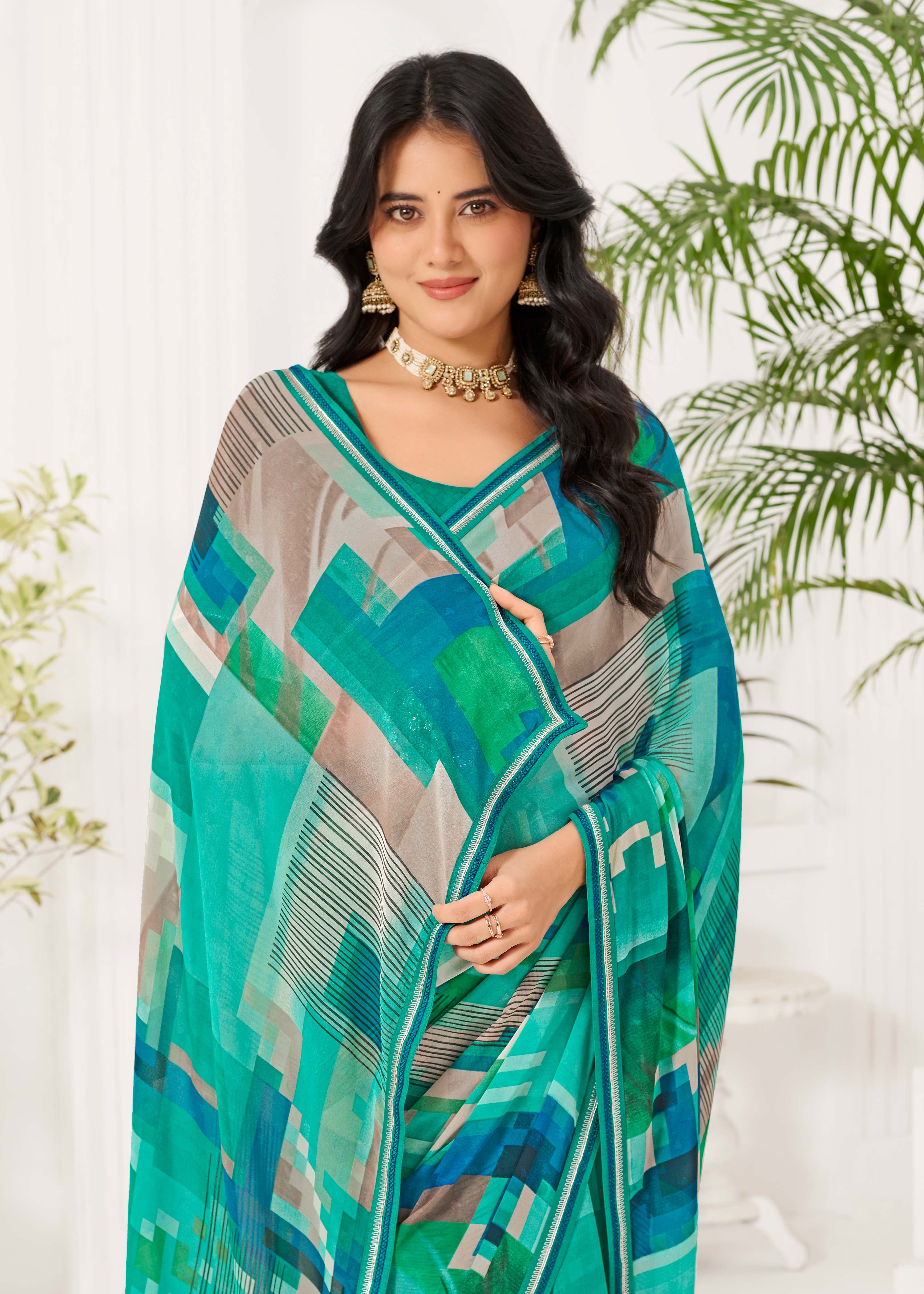 Laxmipati Radha Rani Abstract Georgette Printed Saree in Teal Blue Color