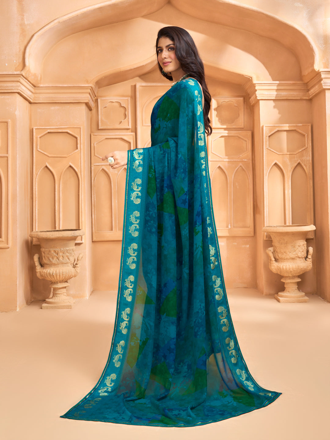 Laxmipati Tohfa Abstract Printed Georgette Saree in Teal Blue Color