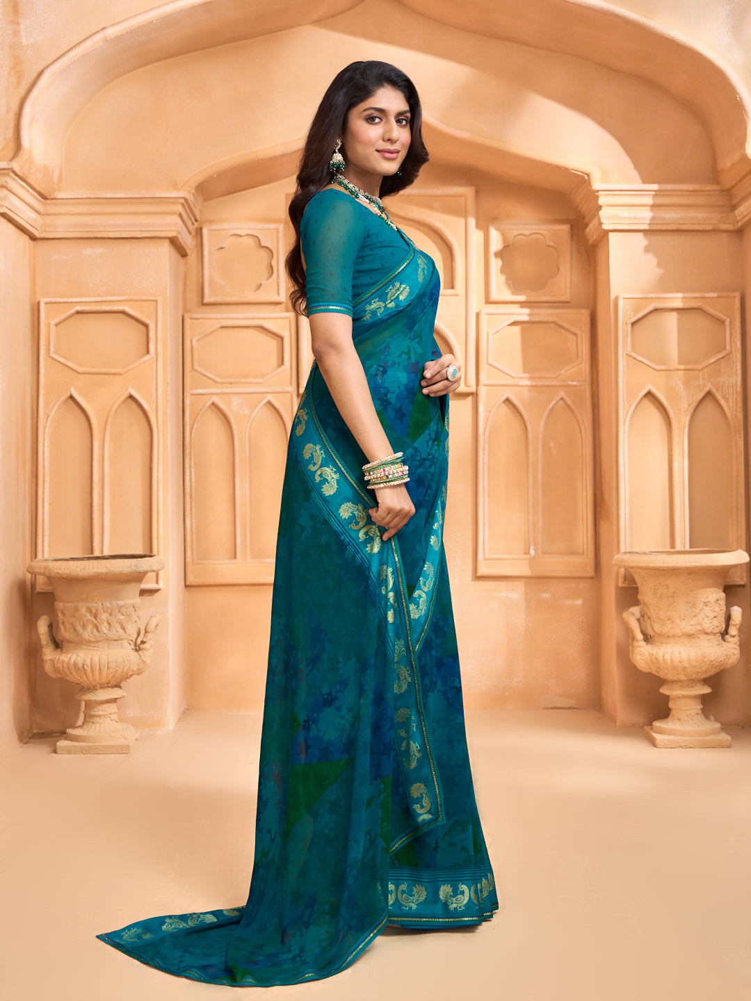 Laxmipati Tohfa Abstract Printed Georgette Saree in Teal Blue Color