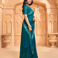 Laxmipati Tohfa Abstract Printed Georgette Saree in Teal Blue Color