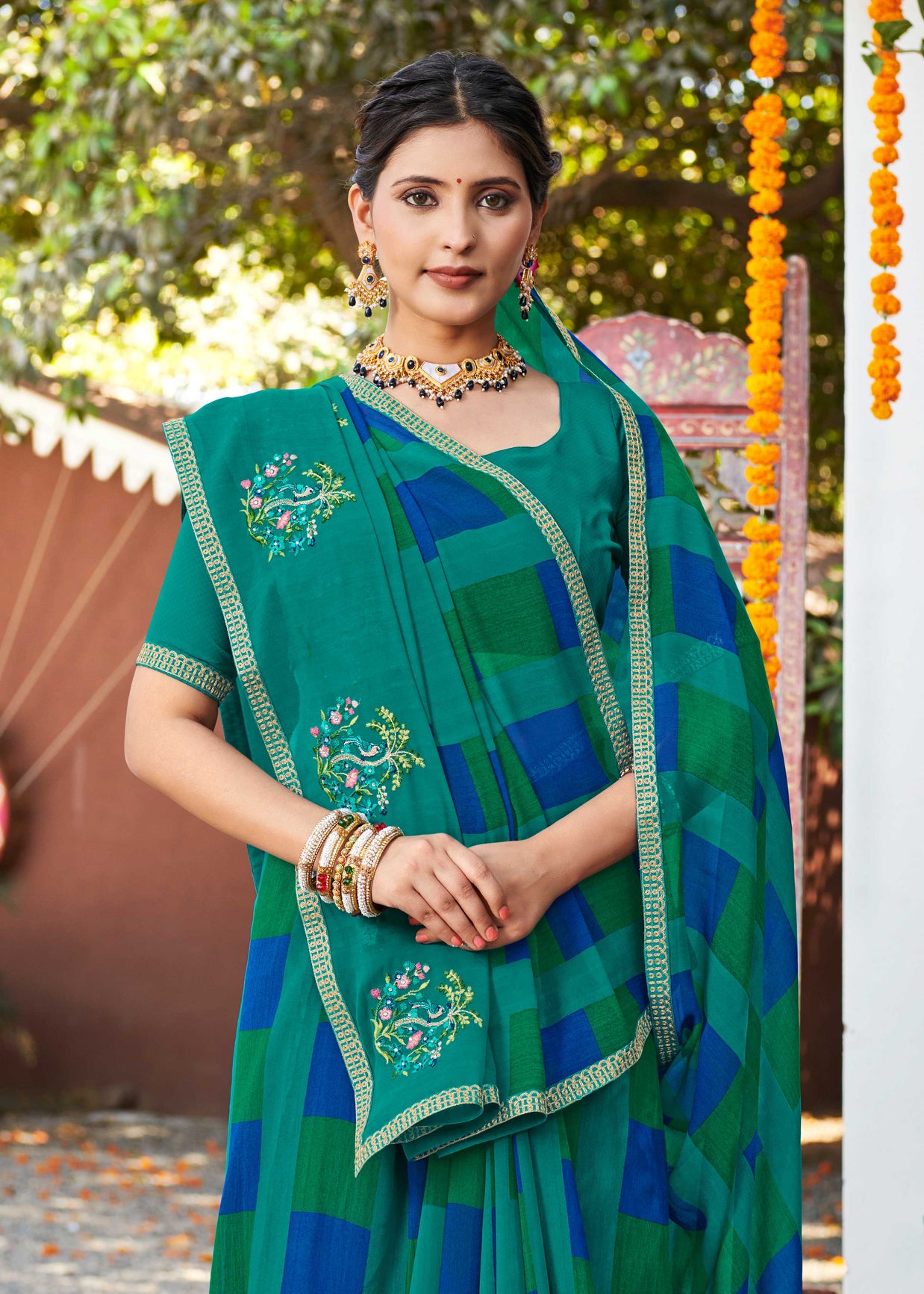 Laxmipati Chanchal Embellished Floral Embroidered Georgette Saree in Teal Blue Color with Unstitched Blouse