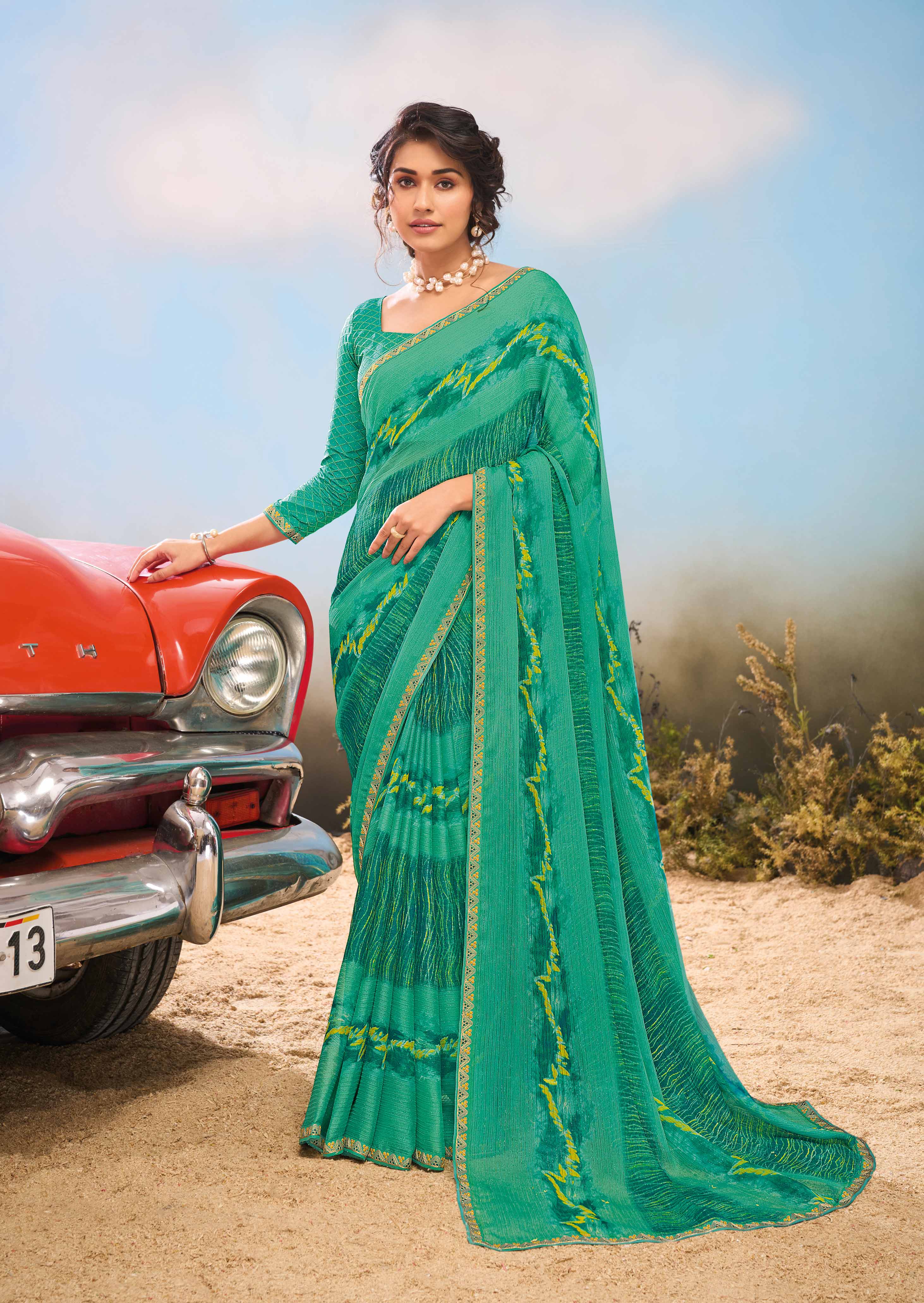 Laxmipati Baarish Abstract Printed Chiffon Saree in Teal Green Color with Unstitched Blouse