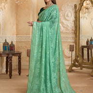 Pastel green saree with printed blouse