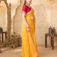Mustard saree with red printed blouse
