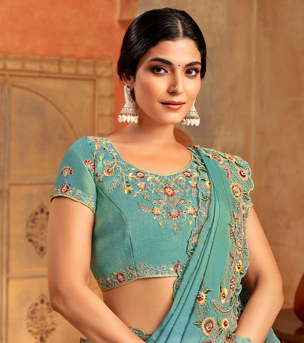 Teal green organza saree