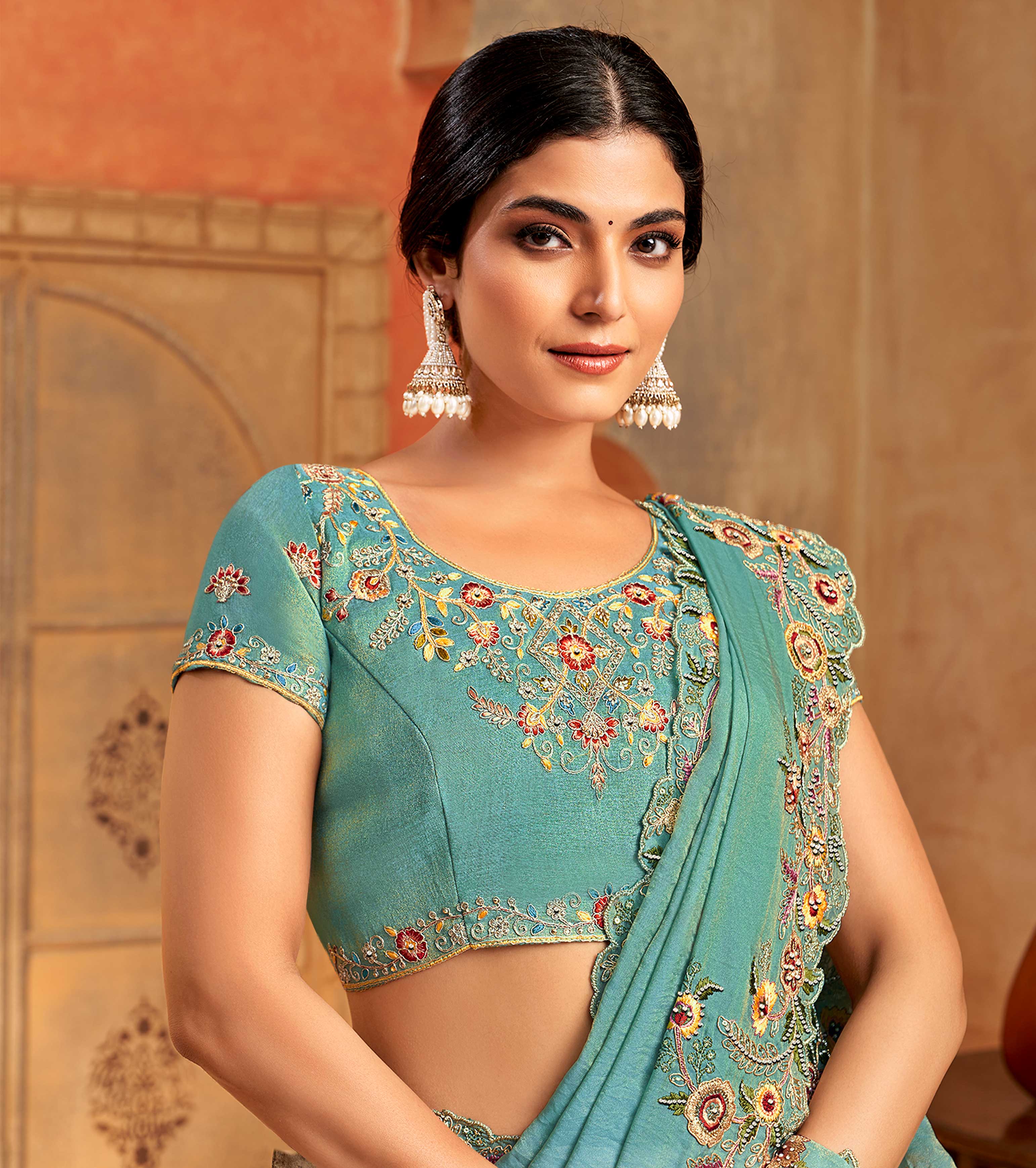 Teal green organza saree