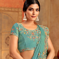 Teal green organza saree