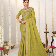 Olive green embroidered chiffon saree