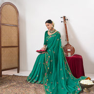 Green embroidered chiffon saree