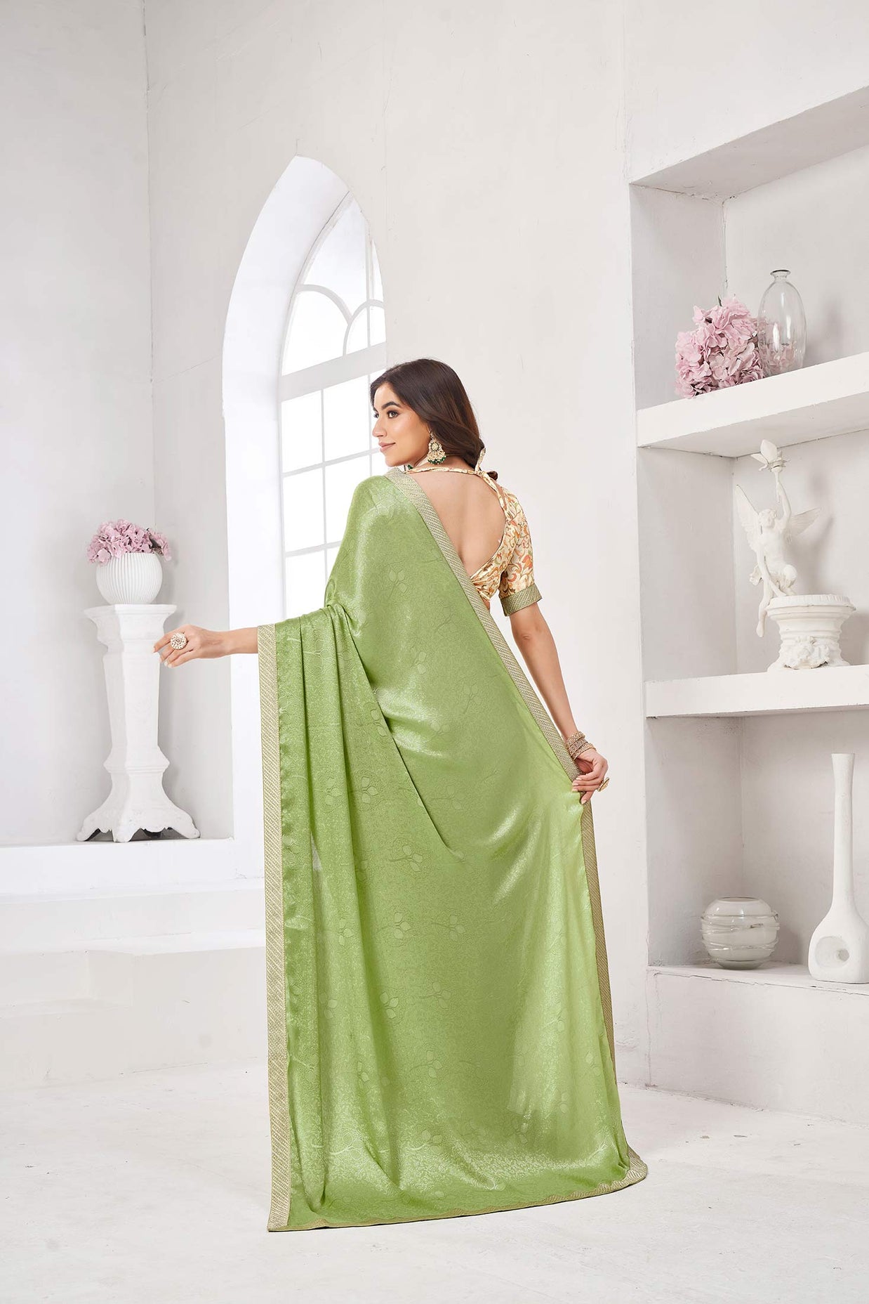 Mint green printed saree with cream blouse