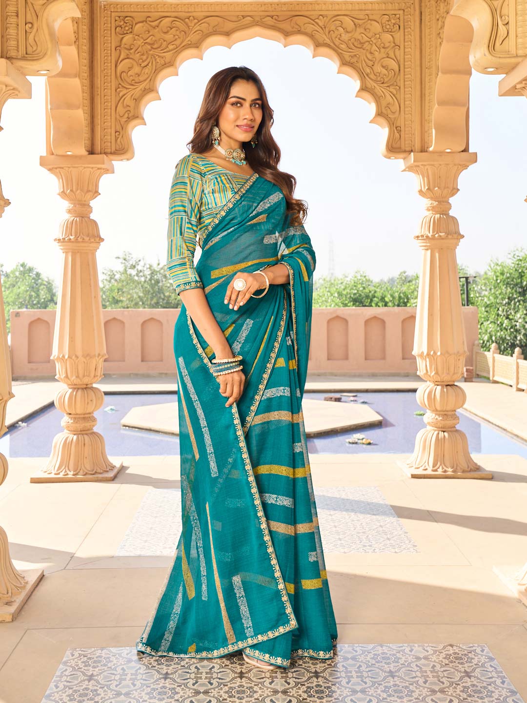 Teal blue ethnic print chiffon saree