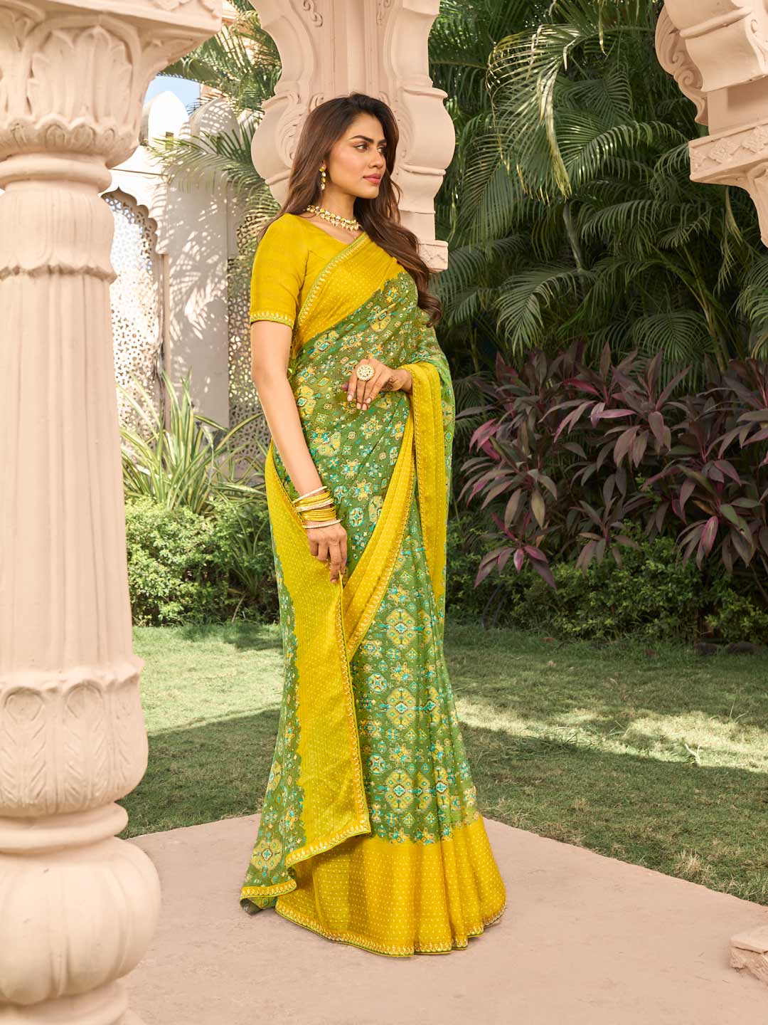 Floral pattern on green chiffon saree