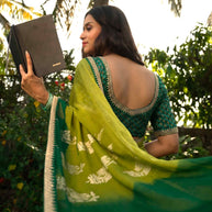 Green embroidered silk blend saree daily wear 