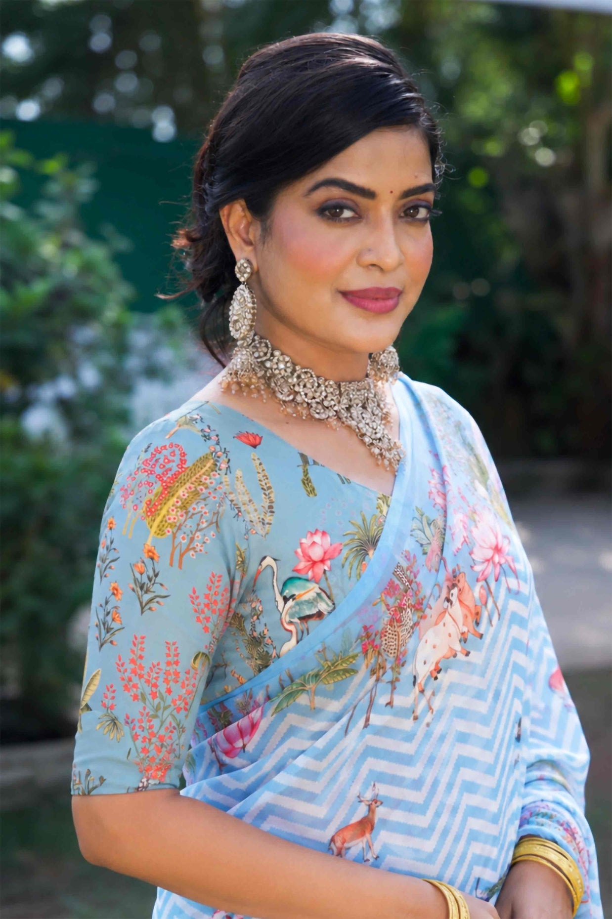 Blue printed georgette saree wedding wear