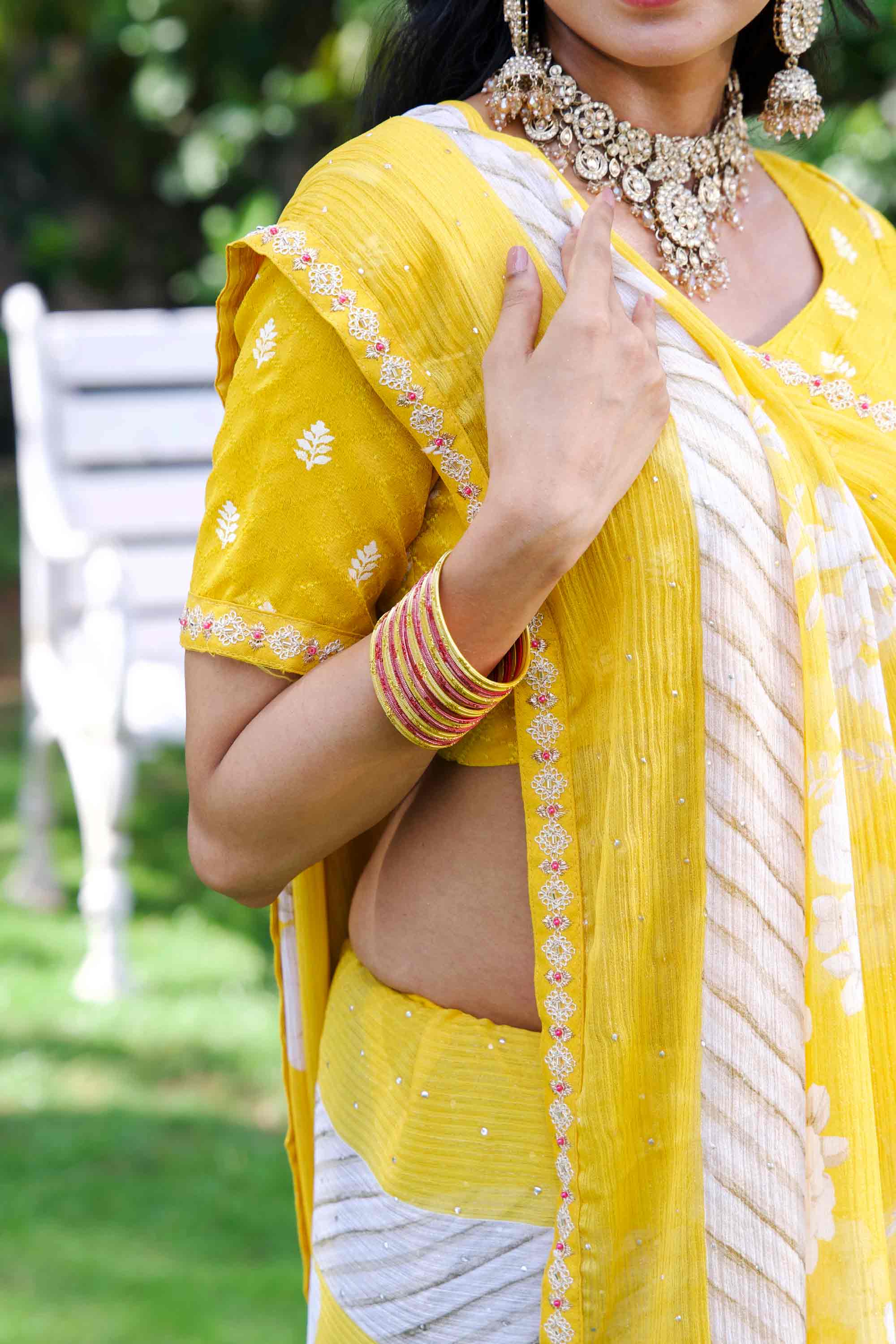 Yellow floral embroidered silk blend saree wedding wear