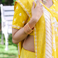 Yellow floral embroidered silk blend saree wedding wear