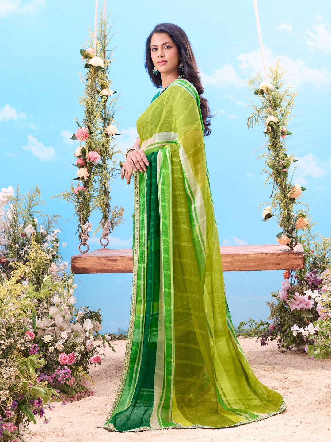 Green woven striped georgette saree festive wear 