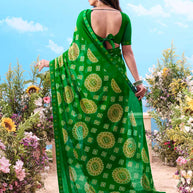 Green paisley printed georgette saree festive wear