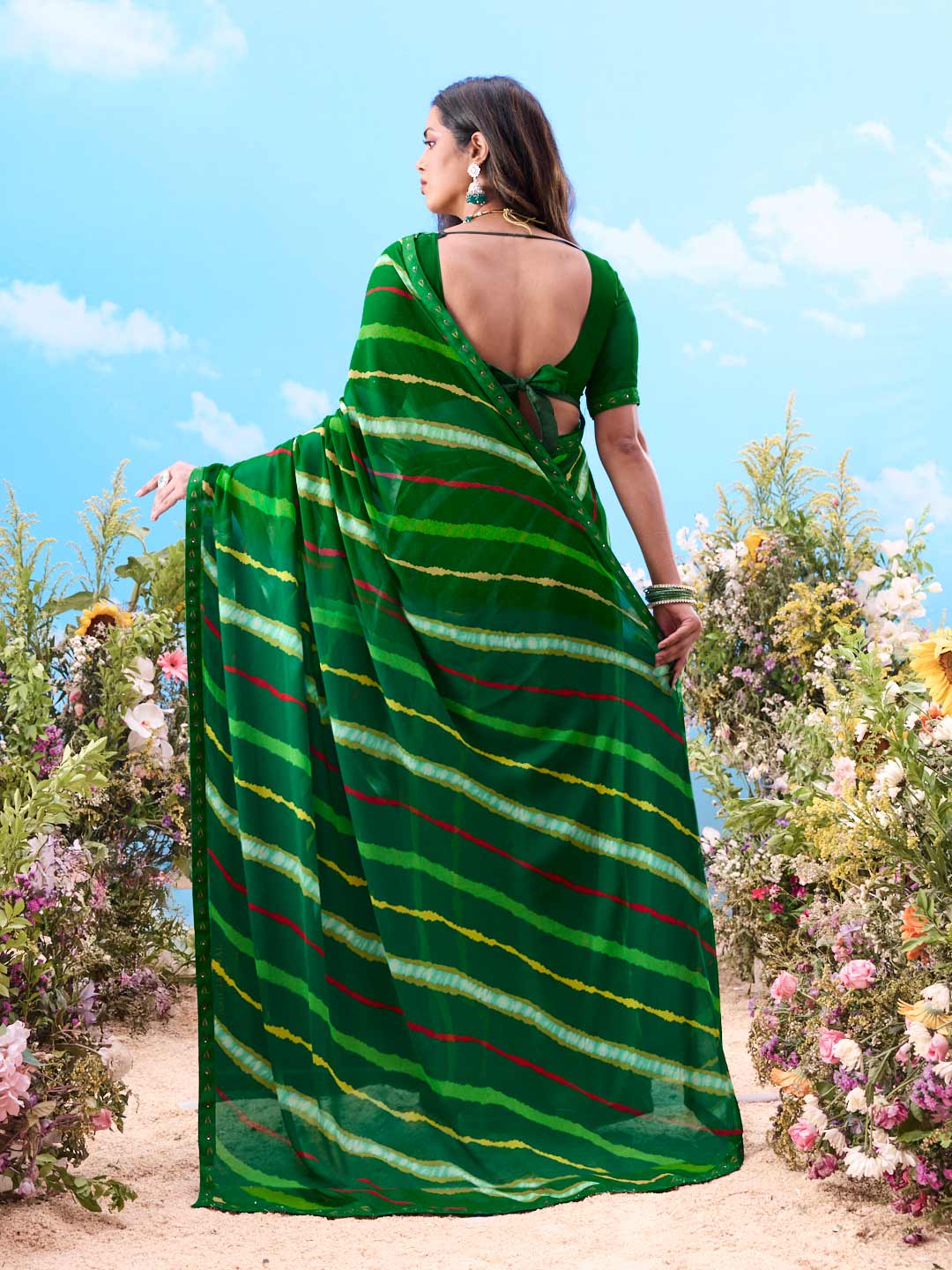Green abstract striped georgette saree festive wear