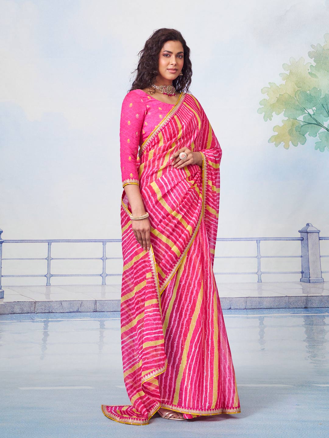 Pink striped embellished chiffon saree occasion wear 