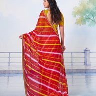 Red scattered motif body with red border featuring gold and silver patterned details chiffon saree ethnic wear