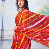 Red lahariya striped with intricate red and white embroidery, narrow yellow piping and scattered sequins chiffon saree festive wear 