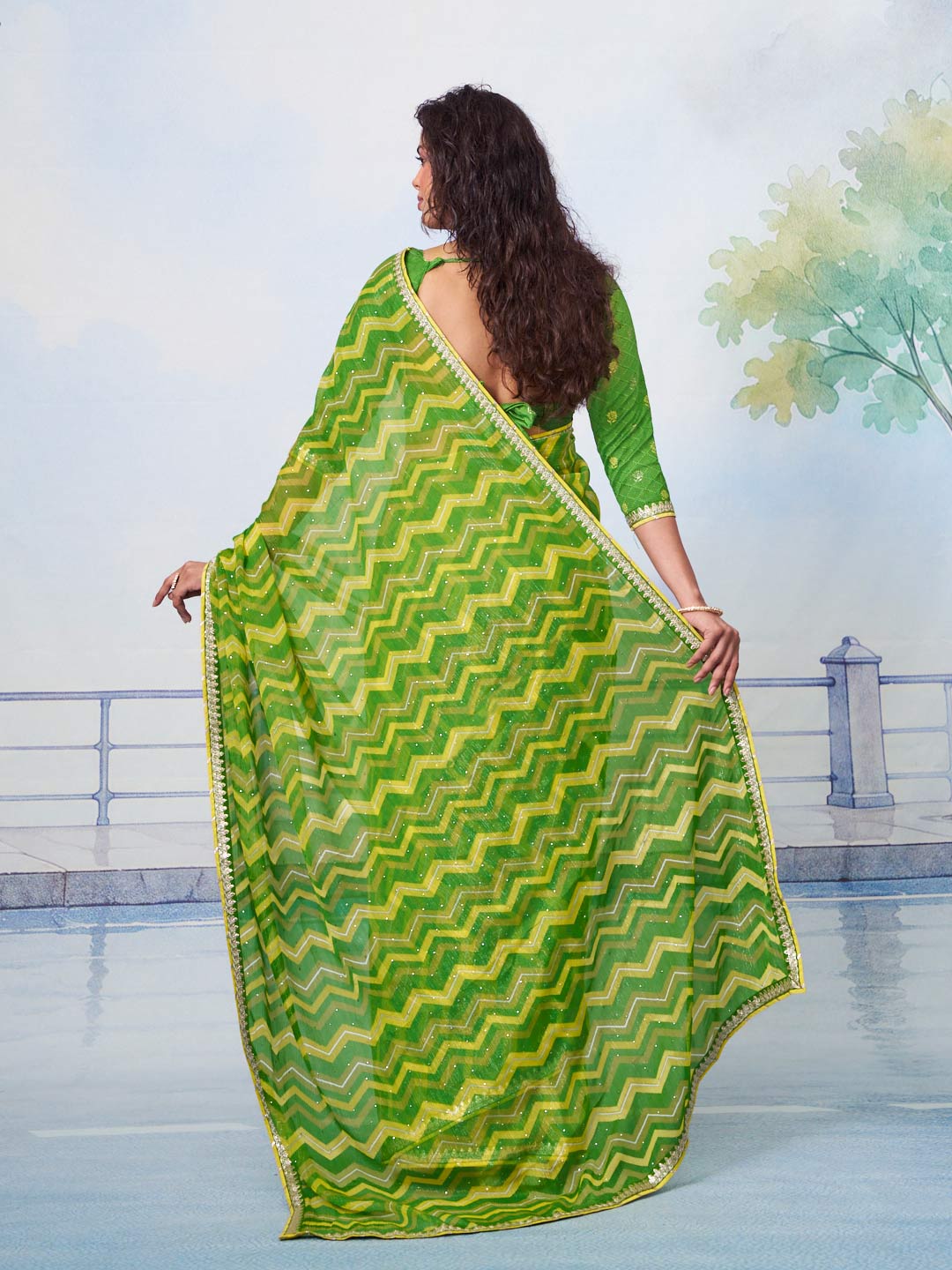 Green printed chiffon saree casual wear