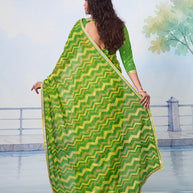 Green printed chiffon saree casual wear