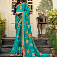 Laxmipati Ajrakh Floral Zari Motifs along with Brocade Border Chiffon Saree in Turquoise Blue Color with Unstitched Blouse